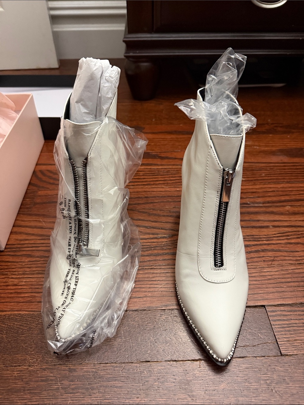 BCBGeneration White Pointed-Toe Front-Zip Ankle Booties with Stud Trim